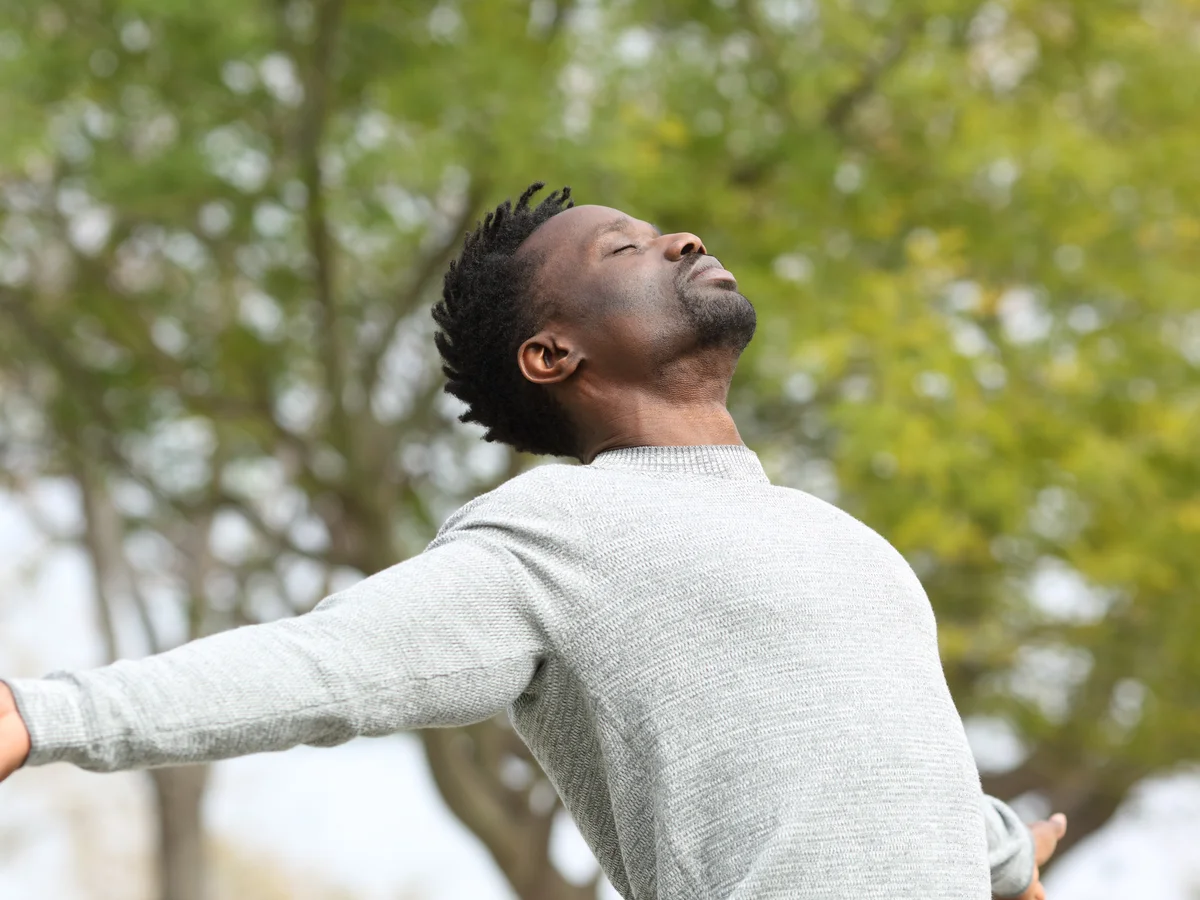 Hands resting gently during a slow breathing exercise